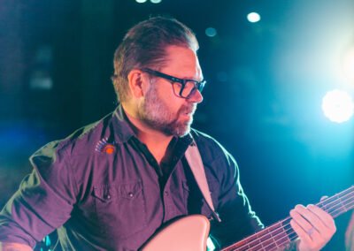 Tyler playing bass guitar with Órale Band live at Maddies in Boise, Idaho