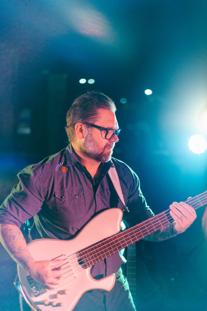 Tyler playing bass guitar with Órale Band live at Maddies in Boise, Idaho